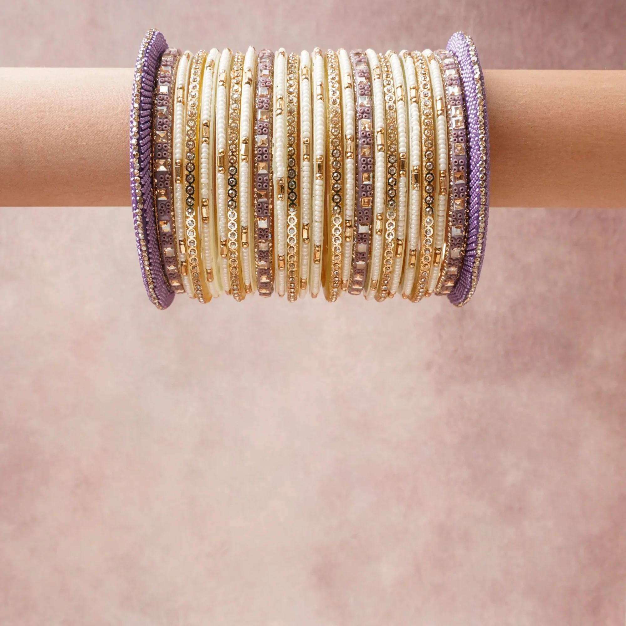 A grounding Cream forms the heart of the set, while touches of Lavender, Clear Crystal, Pearl White add charm.

A thoughtful composition of Metal Alloy, Glass Seed Beads, Rhinestones, Resin, designed to feel complete without being heavy.
Each element layers seamlessly, creating a look that is refined, wearable and quietly striking.